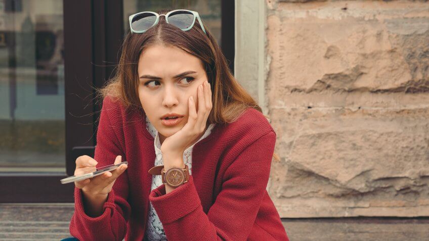 woman stressed phone call