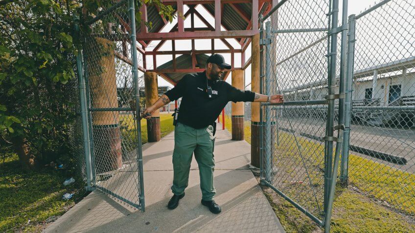 Mandatory Credit: Photo by Gerald Herbert/AP/Shutterstock (10582730d)School Resource Officer Donald Lee locks the gates of the Dr.