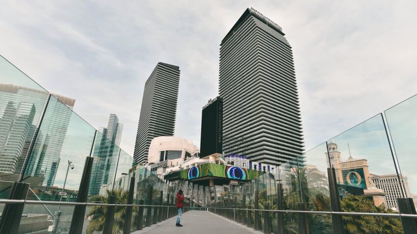 Mandatory Credit: Photo by David Becker/AP/Shutterstock (10587425a)Man stands on a pedestrian overpass along the Las Vegas Strip after all casinos in the state were ordered to shut down due to the coronavirus, in Las Vegas.
