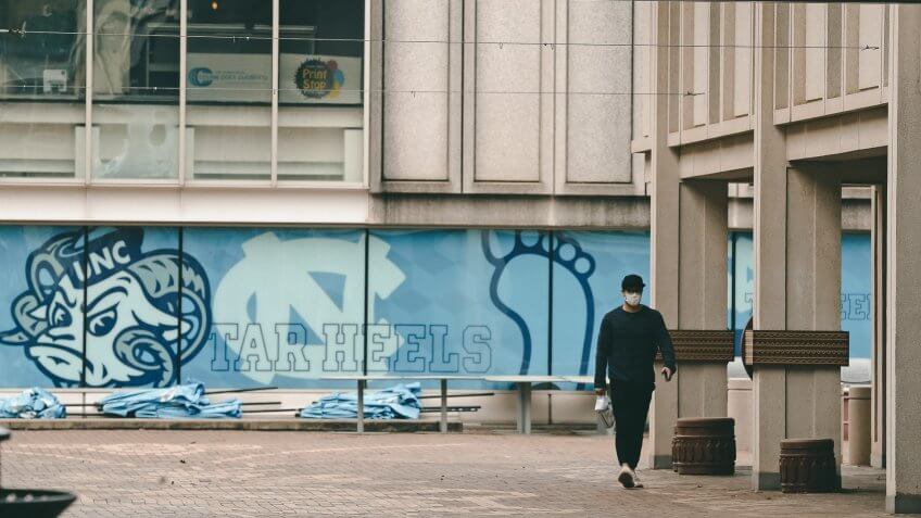 Mandatory Credit: Photo by Gerry Broome/AP/Shutterstock (10587388b)Pedestrian walks through campus at the University of North Carolina in Chapel Hill, N.