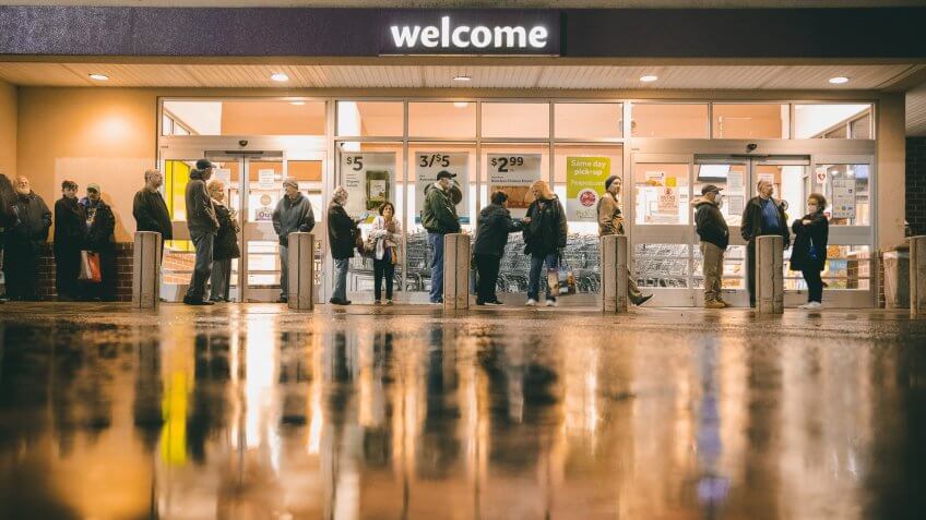 Mandatory Credit: Photo by David Goldman/AP/Shutterstock (10588121c)Shoppers wait in line to enter a Stop & Shop supermarket during hours open daily only for seniors, in North Providence, R.