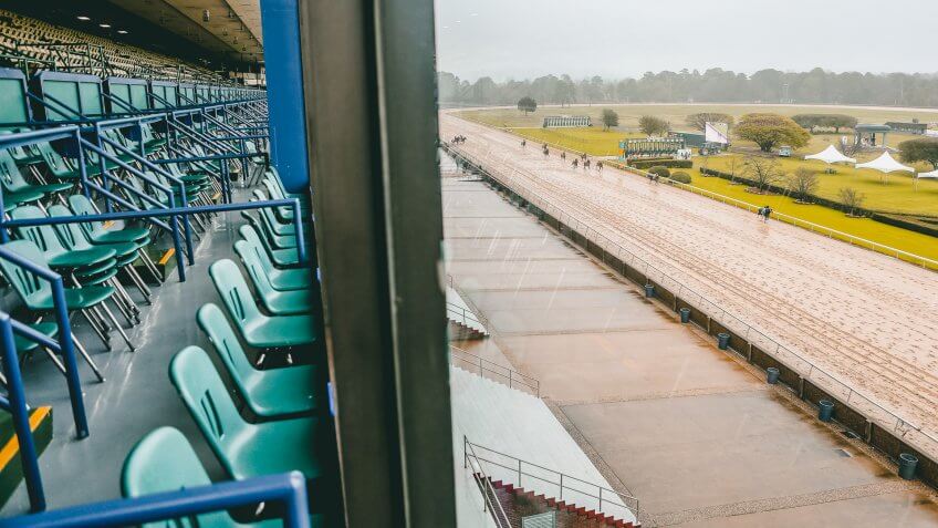 Mandatory Credit: Photo by Justin Manning/CSM/Shutterstock (10583410a)An empty grandstand overlooks racing on Rebel Stakes Day as the novel coronavirus pandemic sparks outbreaks across the country, causing the suspension of nearly all major sporting events with one of the few exceptions being horse racing.