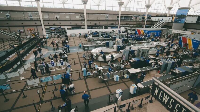 Mandatory Credit: Photo by David Zalubowski/AP/Shutterstock (10587562g)Few passengers file through the north security checkpoint in Denver International Airport as travelers deal with the spread of coronavirus, in Denver.