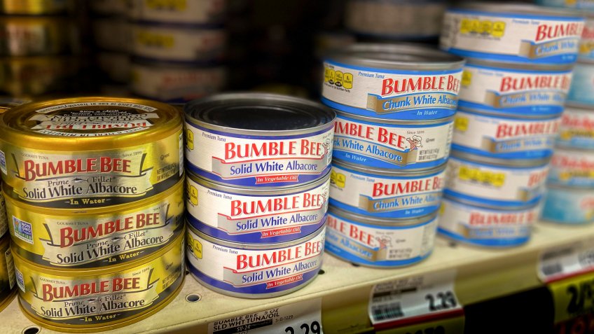 Shiloh, IL—Nov 25, 2019; Cans of tuna fish sitting on a grocery store shelf.