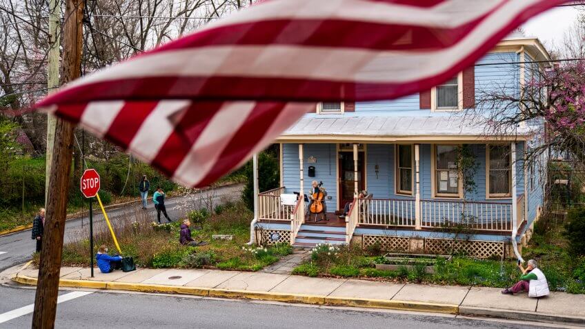 Cellist Jodi Beder performs a daily concert on her front porch in the Washington, DC suburb of Mount Rainier, Maryland, USA, 28 March 2020.