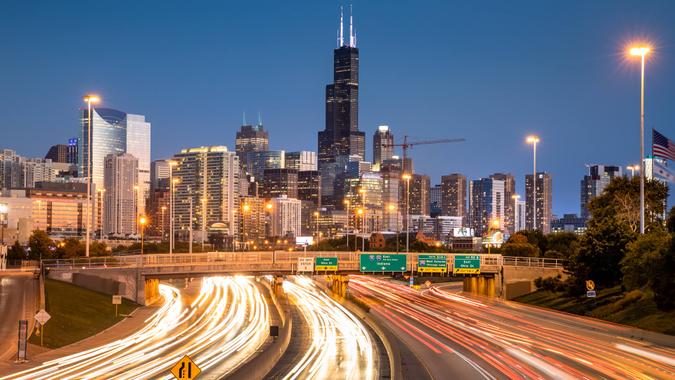 Chicago cityscape looking out over the rush hour traffic commute of the highway in Illinois USA.