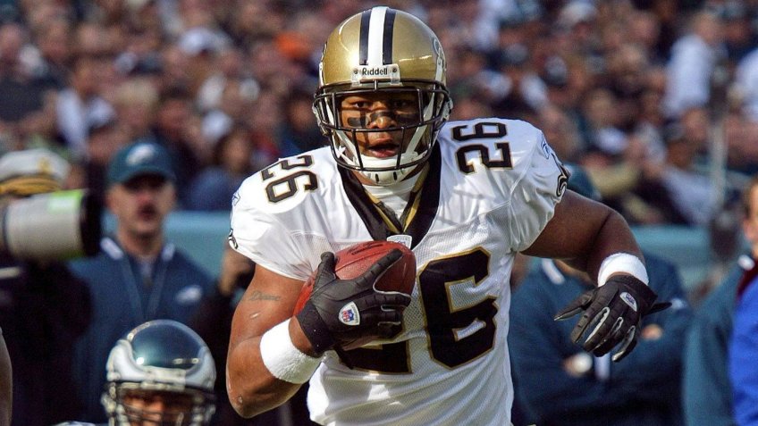 Mandatory Credit: Photo by George Widman/AP/Shutterstock (6033993a)Deuce McAllister New Orleans Saints Deuce McAllister (26) avoids Philadelphia Eagles Brandon Whiting (98) as he carries the ball during an NFL football game in Philadelphia.