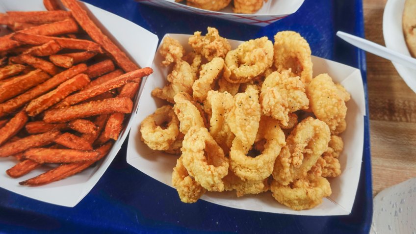 Ipswich, Massachusetts, USA A tray of sweet potato fries and calamari.