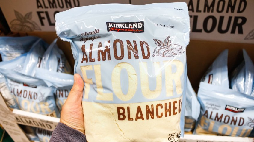 Garden Grove, California/United States - 02/13/2020: A hand holds a package of Kirkland Signature Almond Flour on display at a local Costco.