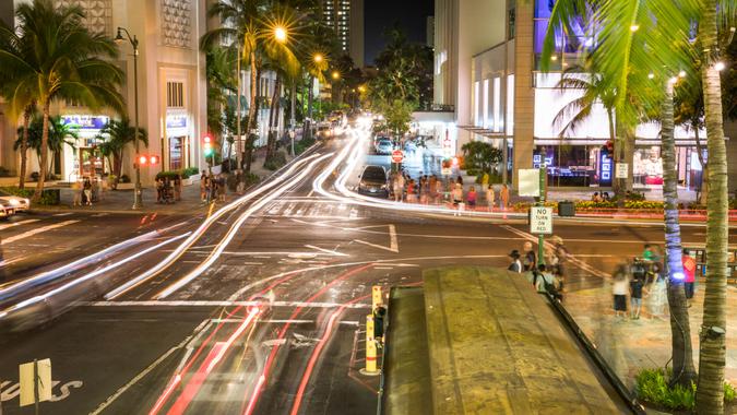 Oahu: Commercial tourist shopping district of Waikiki Beach in Oahu Honolulu Hawaii USA,  Waikīkī's main thoroughfare is Kalakaua Avenue, named after King Kalakaua, which houses most of the high-end hotels, most of the luxury designer brand stores popular surf stores.