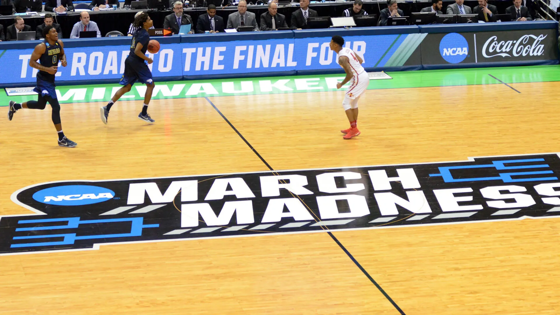 March Madness logo on basketball court