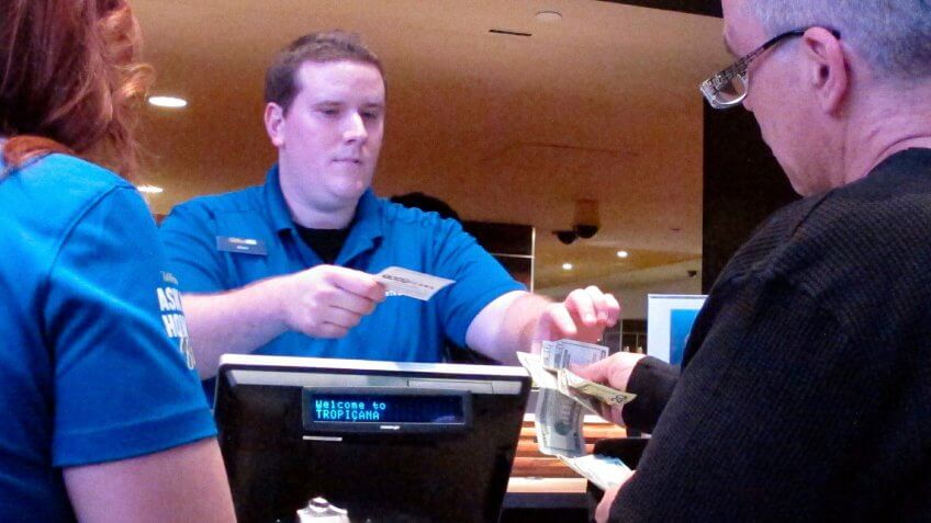 In this March 8, 2019 photo, a gambler makes a sports bet at the Tropicana casino in Atlantic City N.