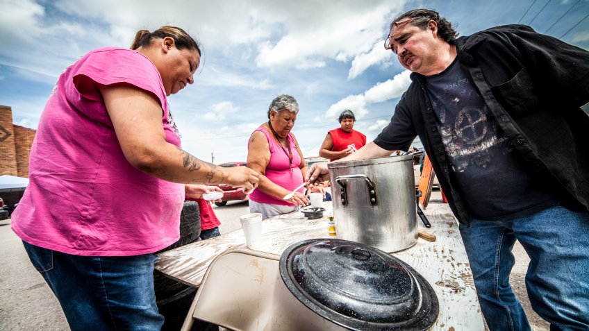 Oglala, USA - July 1, 2014: Indians selling and buying traditional soup called Menudo in Pine Ridge Indians Reservation, South Dakota.