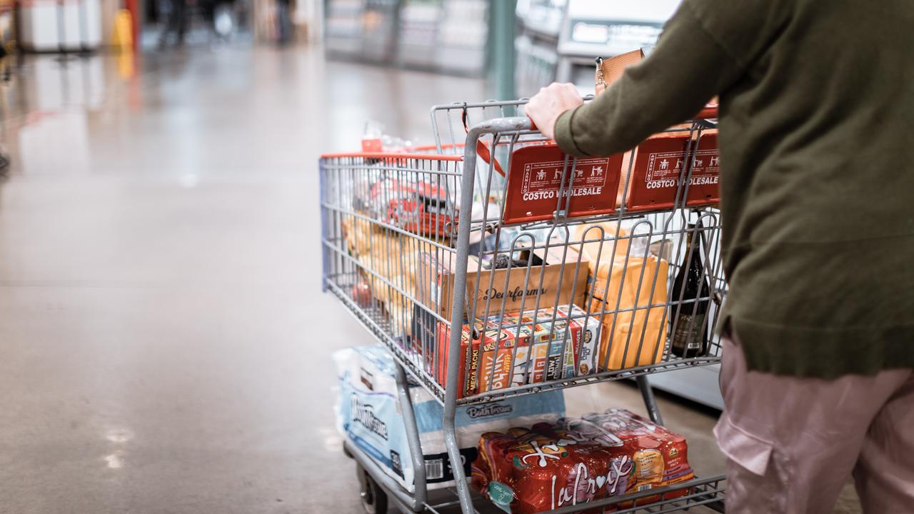 Tigard, Oregon - Nov 8, 2019 : People with carts in Costco Wholesale.