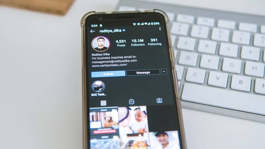 Raditya Dika on Instagram app smartphone GOBankingRates