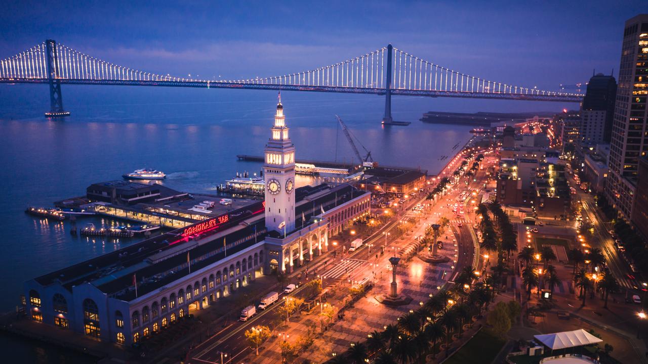 Aerial Cityscape View of San Francisco Ferry Building and Embarcadero at Dusk.