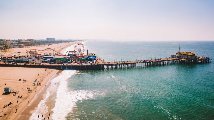 Los Angeles, California, USA - September 12, 2018: Aerial view on the Santa Monica amusement park with roller coaster and ferris wheel near Venice beach in Los Angeles, California.