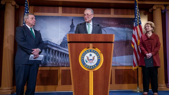 Senate Minority Leader Chuck Schumer (C) speaks as Democratic Senator from Illinois Dick Durbin (L) and Democratic Senator from Michigan Debbie Stabenow (R) keep their social distancing during a press conference at the US Capitol in Washington, DC, USA, 17 March 2020.