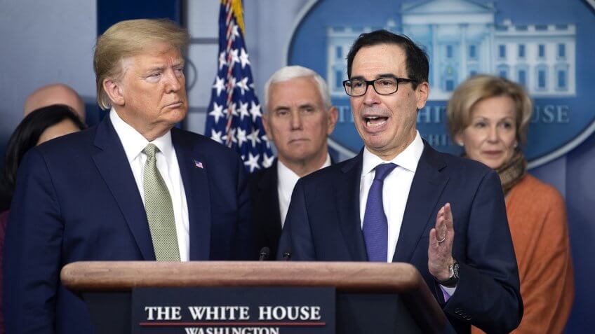 United States Secretary of the Treasury Steven Mnuchin, second right, joined by US President Donald Trump, left, US Vice President Mike Pence, center left, Dr.