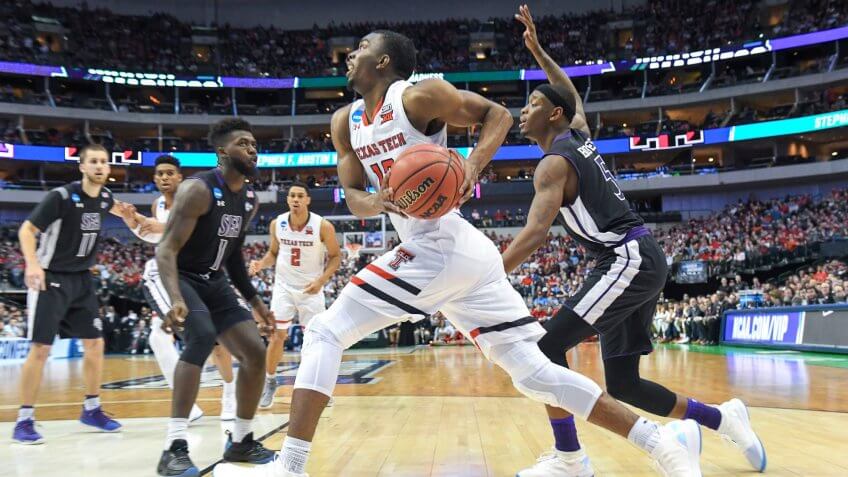 Texas Tech Red Raiders guard Keenan Evans #12 drives the baseline in the first half in the first round of the NCAA March Madness Men's Basketball game between the Stephen F Austin Lumberjacks and the Texas Tech University Red Raiders at the American Airlines Center in Dallas, TX Albert Pena/CSMNCAA March Madness Basketball SFA vs Texas Tech, Dallas, USA - 14 Mar 2018.