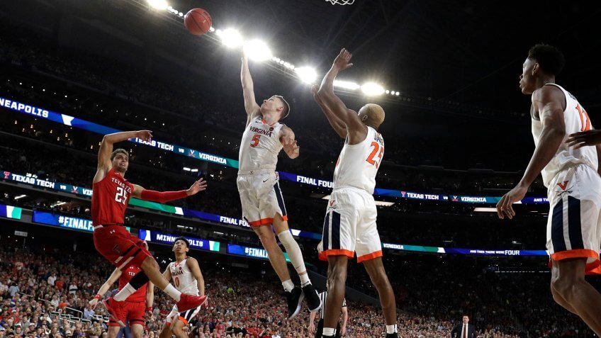 Texas Tech guard Davide Moretti left, shoots over Virginia's Kyle Guy (5) and Mamadi Diakite during the first half in the championship game of the Final Four NCAA college basketball tournament, in MinneapolisFinal Four Texas Tech Virginia Basketball - 08 Apr 2019.