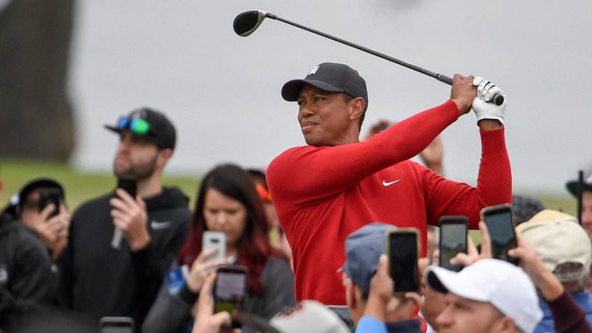 Mandatory Credit: Photo by Denis Poroy/AP/Shutterstock (10554134a)Tiger Woods watches his tee shot on the second hole of the South Course at Torrey Pines Golf Course during the final round of the Farmers Insurance golf tournament Sunday, in San Diego.