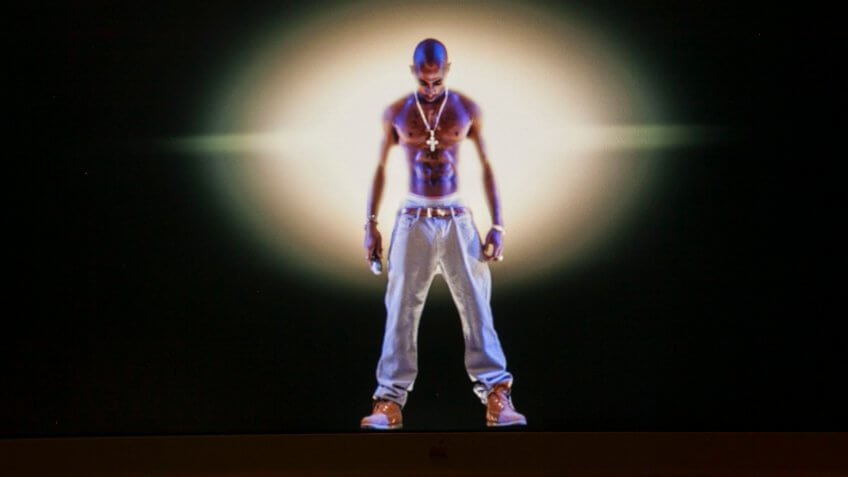 Mandatory Credit: Photo by Damian Dovarganes/AP/Shutterstock (6244237c)Tupac Shakur A video image of the Tupac Shakur hologram is displayed on a computer monitor at the Subtractive Studio in Santa Monica, Calif.