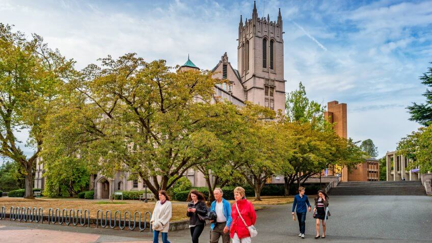 People walk on a walkway at the University of Washington main campus in Seattle, USA.