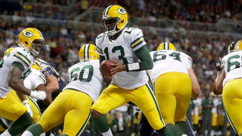 Mandatory Credit: Photo by Seth Perlman/AP/Shutterstock (6020240dk)Vince Young Green Bay Packers quarterback Vince Young hands off during the third quarter of an NFL football game against the St.