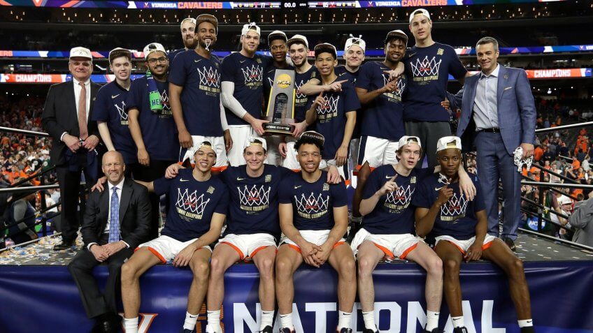 Virginia players celebrate after the championship game against Texas Tech in the Final Four NCAA college basketball tournament, in Minneapolis.