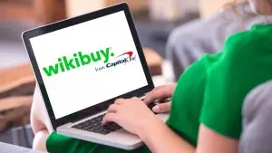 Woman using blank white sceen laptop computer.