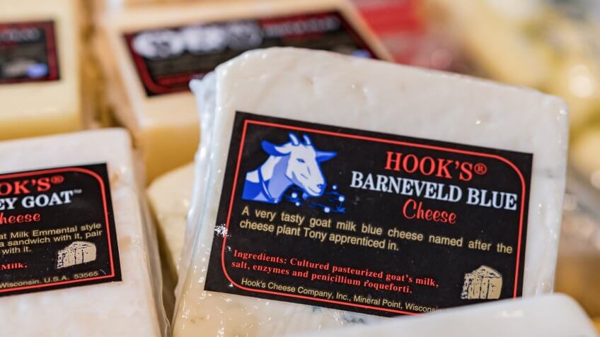 Illustrative editorial image of local Hook's Barneveld Blue Cheese goat cheese in a display case in Wisconsin.