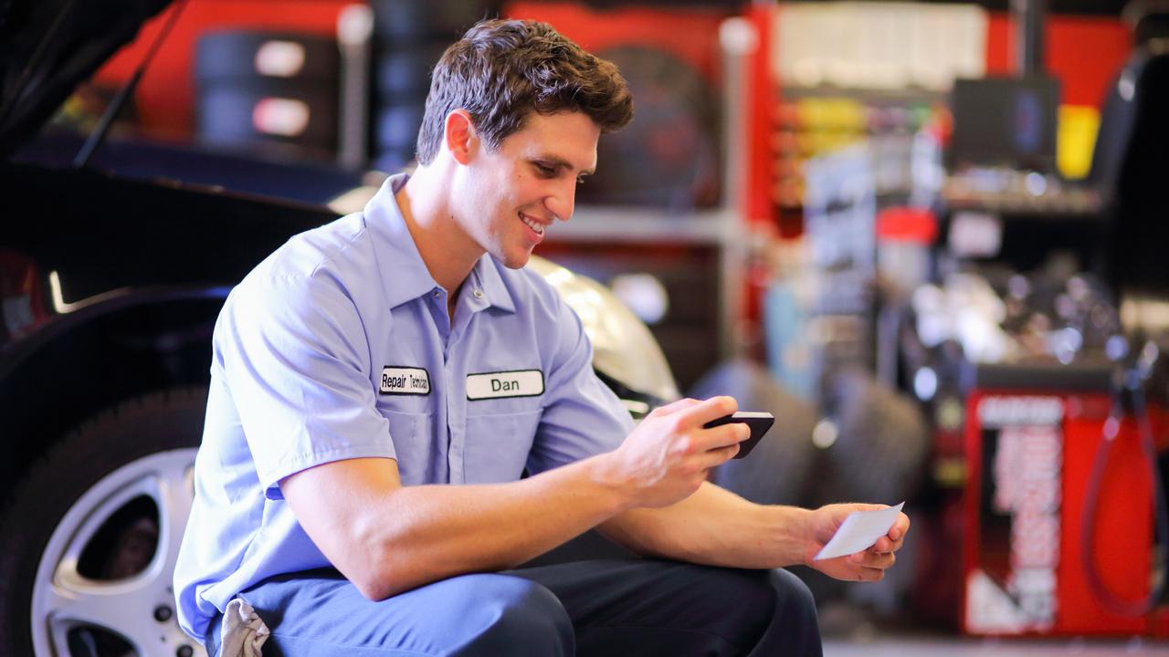 Auto Mechanic Depositing Check with Mobile Phonehttp://i449.