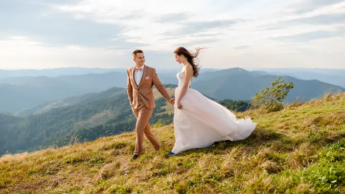 Young love couple celebrating a wedding in the mountains.