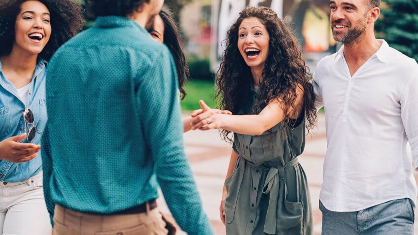 Group of friends having fun outdoors in the city.