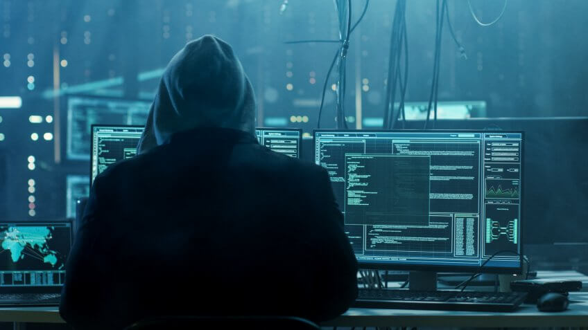Dangerous Hooded Hacker Breaks into Government Data Servers and Infects Their System with a Virus.