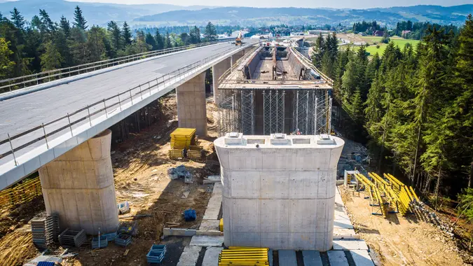 Aerial drone view on highway bridge in construction.