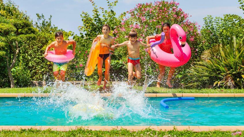 kids jumping into water