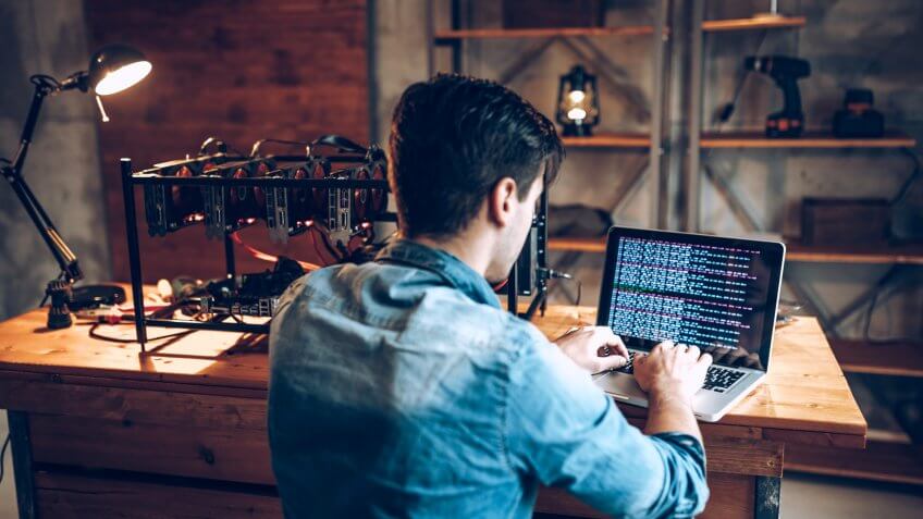 IT guy launching his first mining rig for cryptocurrency.