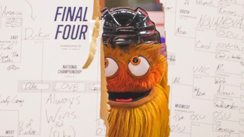 Philadelphia Flyers mascot Gritty looks on after ripping up his NCAA March Madness Bracket during the NHL game between the New York Islanders and Philadelphia Flyers at Well Fargo Center in Philadelphia, PennsylvaniaNHL Islanders vs Flyers, Philadelphia, USA - 23 Mar 2019.