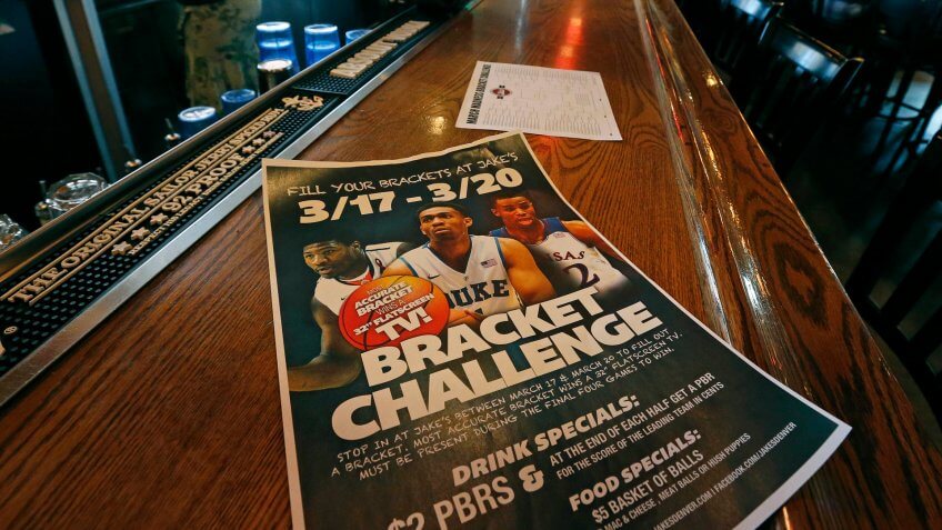 A poster advertises the "Bracket Challenge," whereby patrons can complete an NCAA basketball tournament bracket, at Jake's sports bar, in Denver, .