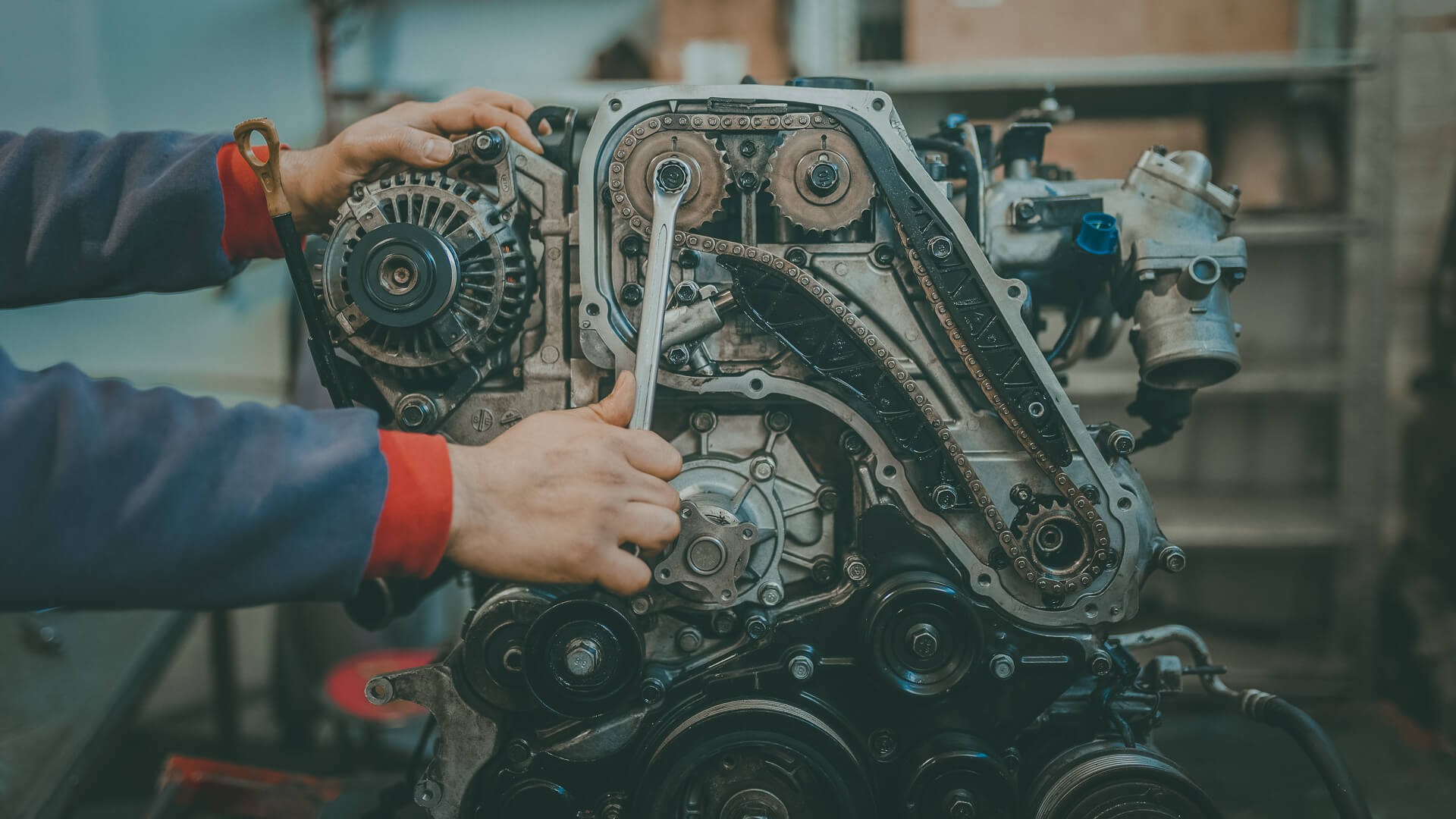 The Most Expensive Car Repairs That Will Make You Want To Sell ... - Mechanic Working On Engine IStock 1097603382