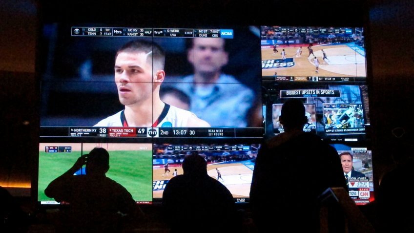 Customers watch a game during the NCAA March Madness college basketball tournament at the Hard Rock casino in Atlantic City N.