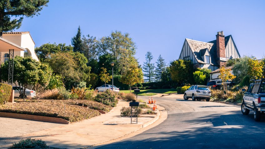 Street in the residential area of Oakland on a sunny autumn day, San Francisco bay area, California.
