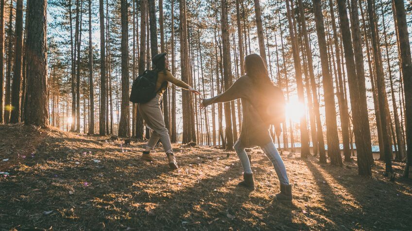two girls hiking in wilderness