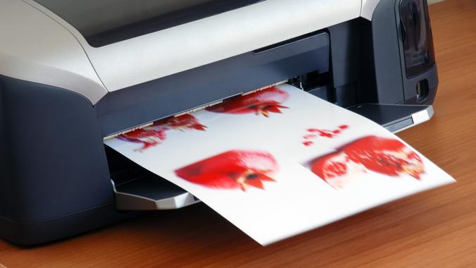 A printer printing an image on paper printing images.