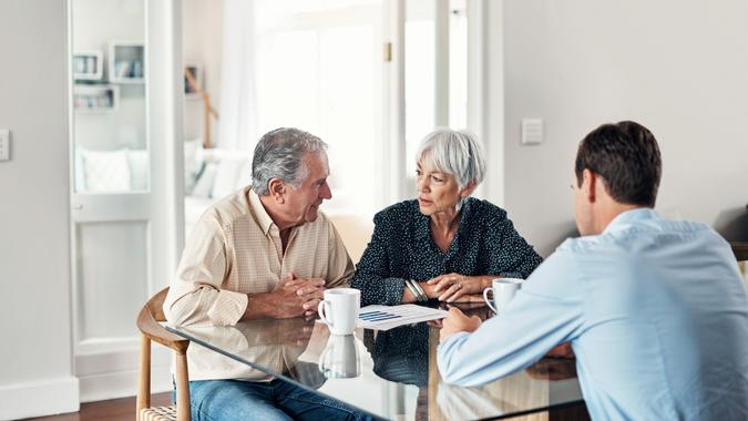 Shot of a senior couple getting advice from their financial consultant at home.