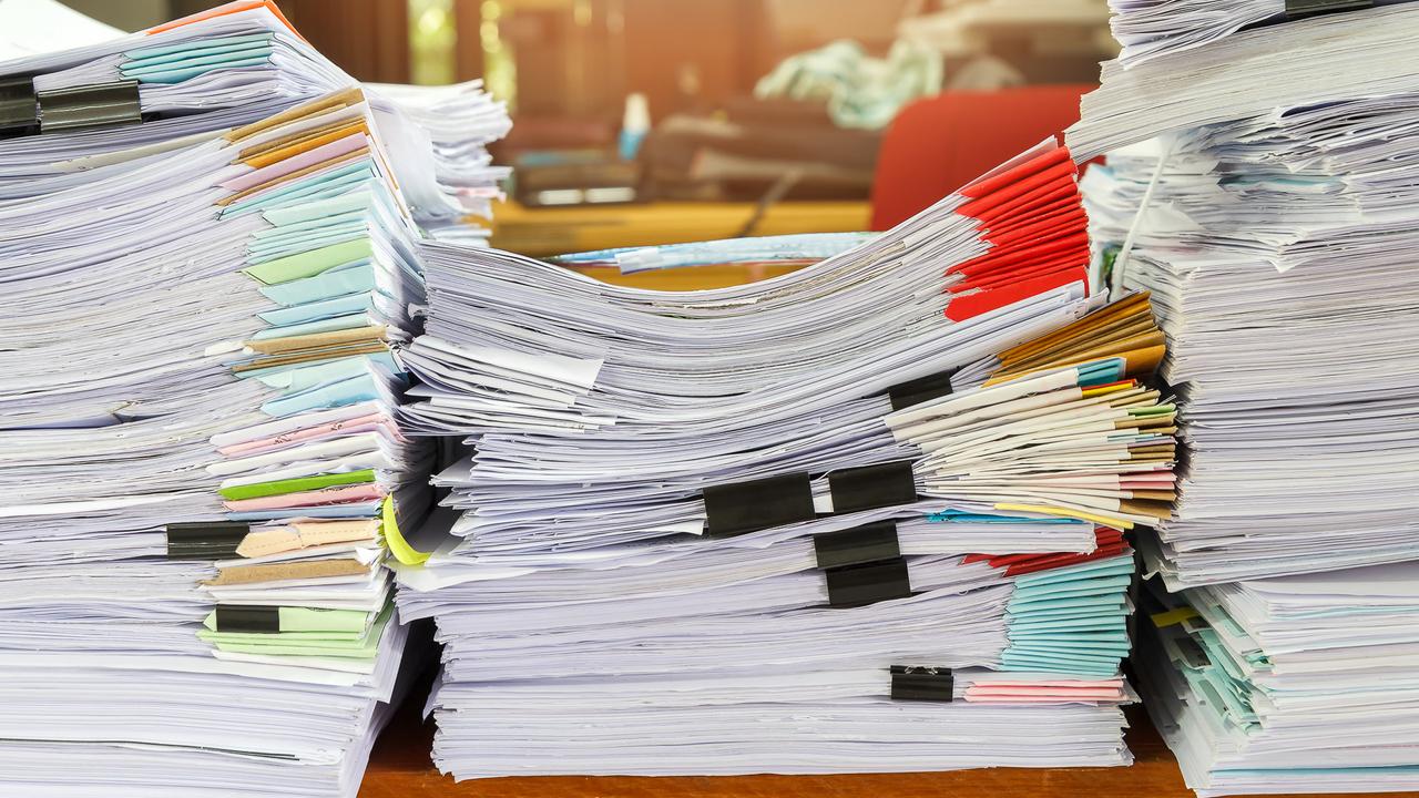 Close up of business documents stack on desk , report papers stack.