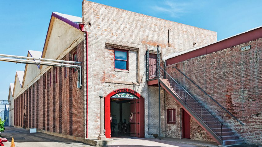 This repurposed older brick structure is part of the winery and tasting room for one of the local wines in San Joaquin County of Northern California near Acampo.