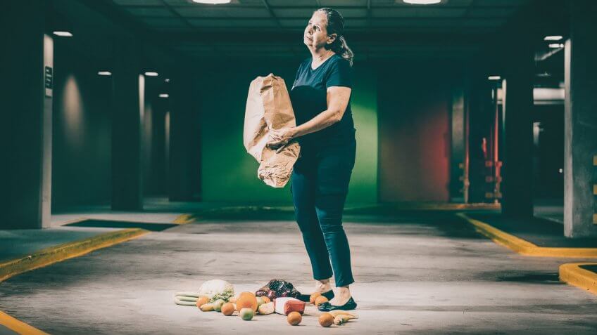 woman dropping her groceries